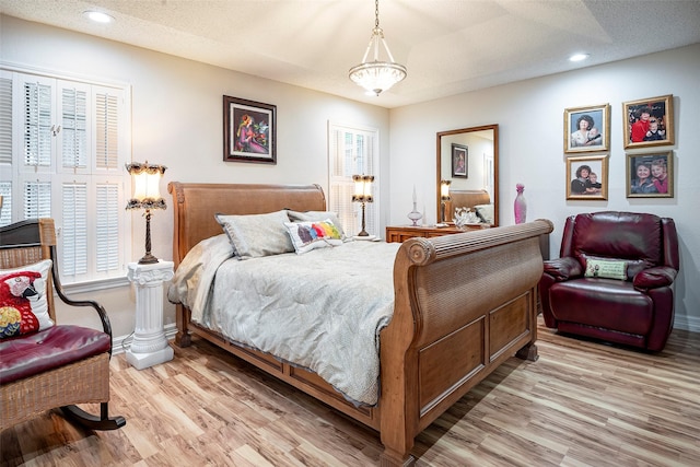 4728 Misty Oak Ln, Arlington, TX 76017 - bedroom featuring light wood-type flooring, baseboards, and recessed lighting