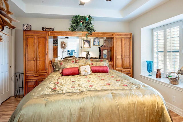 4728 Misty Oak Ln, Arlington, TX 76017 - bedroom with light wood-type flooring, multiple windows, and a ceiling fan