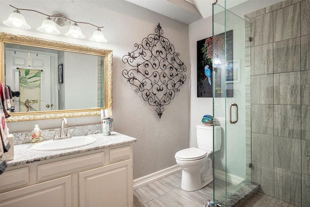 4728 Misty Oak Ln, Arlington, TX 76017 - bathroom featuring baseboards, a stall shower, toilet, and vanity