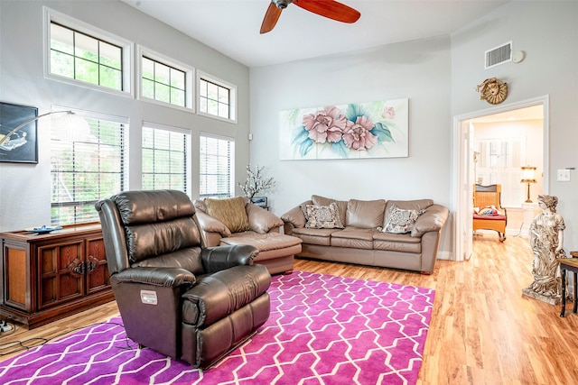 4728 Misty Oak Ln, Arlington, TX 76017 - living room with ceiling fan, light wood-type flooring, and a high ceiling