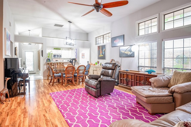 4728 Misty Oak Ln, Arlington, TX 76017 - living area with a ceiling fan, light wood-style floors, and a chandelier