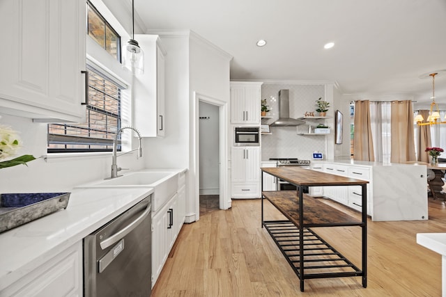 2320 Table Rock Ct, Arlington, TX 76006 - kitchen with appliances with stainless steel finishes, wall chimney range hood, a sink, white cabinetry, and ornamental molding