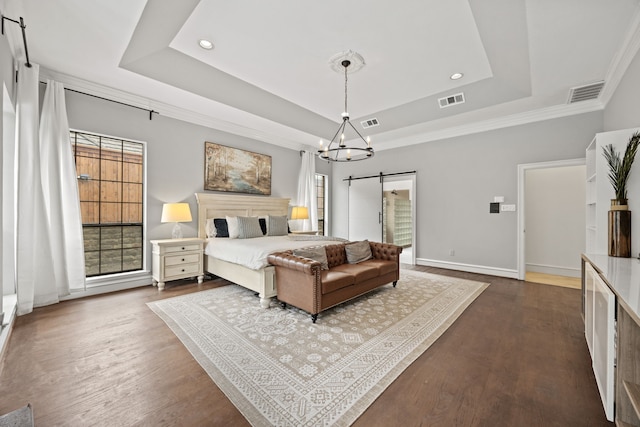 2320 Table Rock Ct, Arlington, TX 76006 - bedroom featuring a barn door, a tray ceiling, dark wood-type flooring, ornamental molding, and recessed lighting