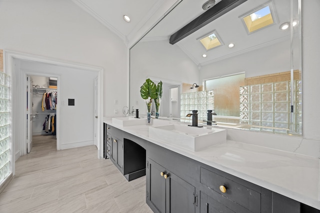 2320 Table Rock Ct, Arlington, TX 76006 - bathroom with a skylight, crown molding, double vanity, a walk in closet, and walk in shower
