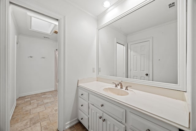 2320 Table Rock Ct, Arlington, TX 76006 - bathroom with vanity, stone finish flooring, baseboards, and crown molding