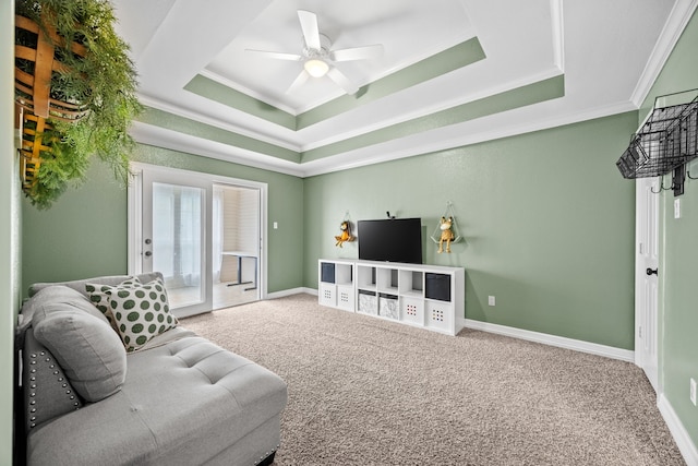 2320 Table Rock Ct, Arlington, TX 76006 - carpeted living area featuring a tray ceiling, ornamental molding, ceiling fan, and baseboards