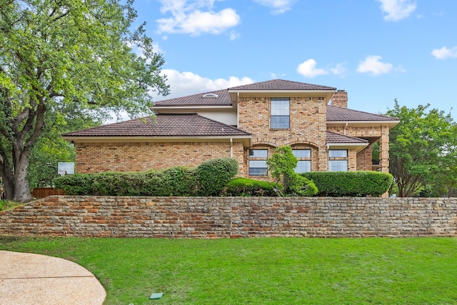 2320 Table Rock Ct, Arlington, TX 76006 - view of front of house featuring a front lawn, brick siding, a chimney, and a tiled roof
