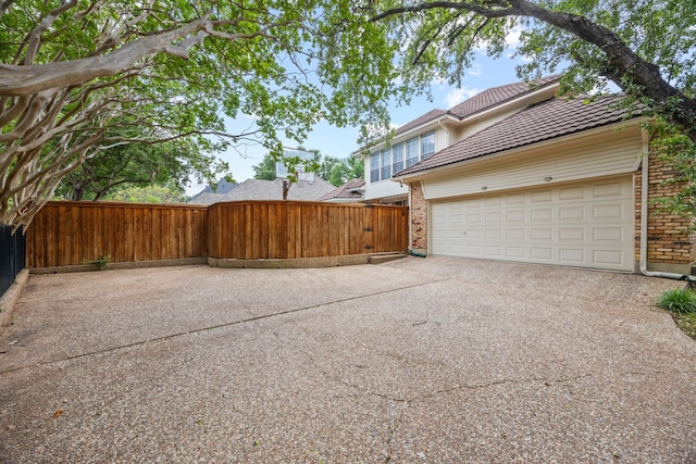 2320 Table Rock Ct, Arlington, TX 76006 - view of home's exterior with brick siding, driveway, and an attached garage