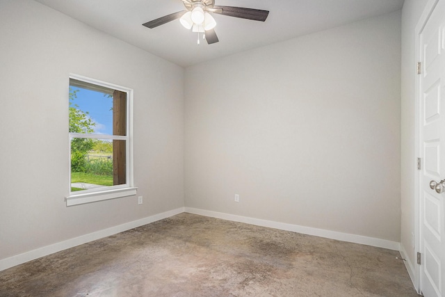 4041/2 Evans St, Cleburne, TX 76031 - empty room with concrete flooring, ceiling fan, and baseboards