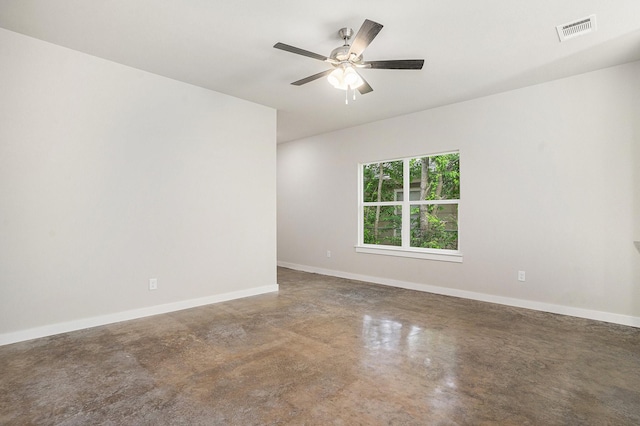 4041/2 Evans St, Cleburne, TX 76031 - empty room featuring finished concrete floors, baseboards, and ceiling fan