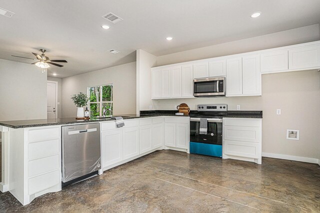4041/2 Evans St, Cleburne, TX 76031 - kitchen featuring appliances with stainless steel finishes, concrete flooring, a peninsula, white cabinets, and recessed lighting