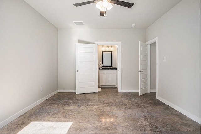 4041/2 Evans St, Cleburne, TX 76031 - unfurnished bedroom featuring baseboards, a sink, a ceiling fan, and concrete flooring