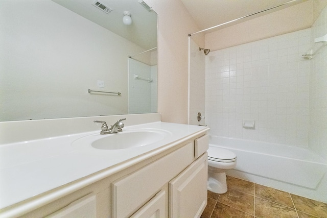 7601 Jennifer Ln, Frisco, TX 75034 - bathroom featuring toilet, vanity, shower / bath combination, and tile patterned flooring