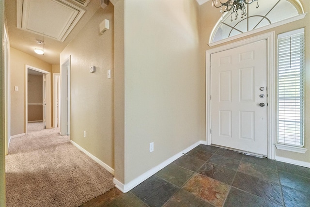 7601 Jennifer Ln, Frisco, TX 75034 - entrance foyer featuring baseboards and dark stone finish floors