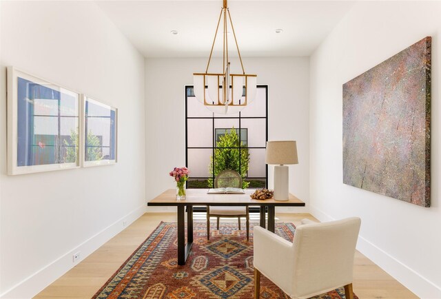 9895 Kingsway Ave, Dallas, TX 75230 - office with a chandelier, wood finished floors, and baseboards