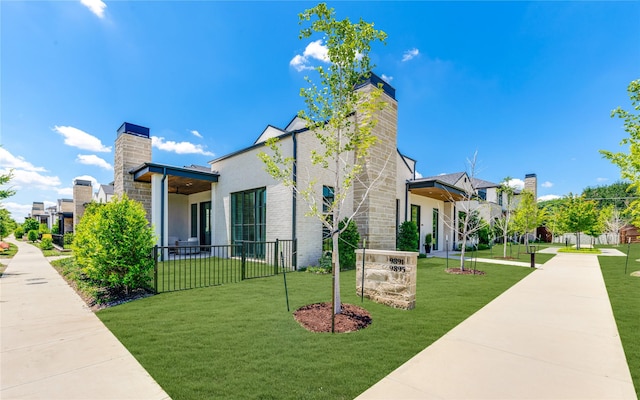 9895 Kingsway Ave, Dallas, TX 75230 - view of property exterior with a chimney