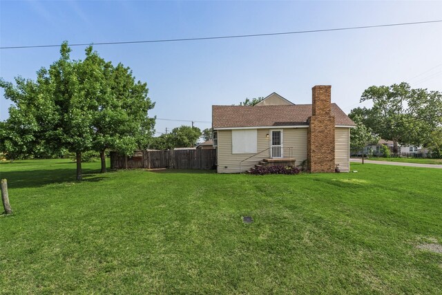 view of home's exterior featuring a chimney