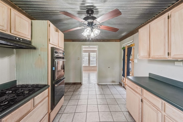 kitchen with black appliances, light brown cabinetry, and a ceiling fan