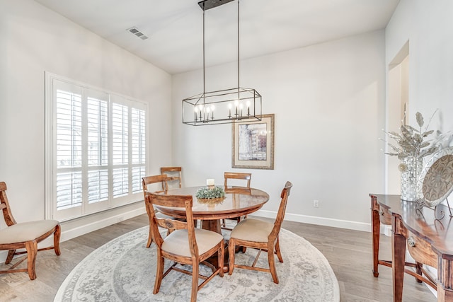 2826 Shane Dr, Midlothian, TX 76065 - dining area featuring a chandelier, baseboards, and wood finished floors