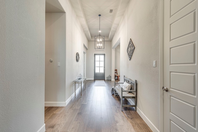 2826 Shane Dr, Midlothian, TX 76065 - doorway to outside featuring a textured wall, wood finished floors, a chandelier, and baseboards