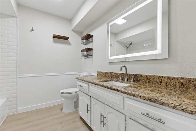 320 Allenwood Dr, Princeton, TX 75407 - bathroom featuring wood finished floors, toilet, and vanity