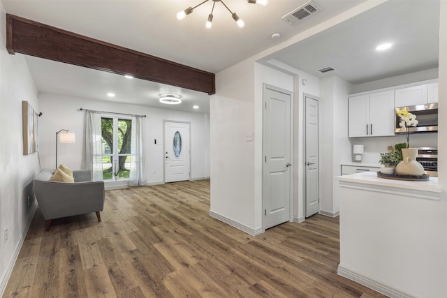 1900 Sussex Dr, Garland, TX 75041 - foyer featuring wood finished floors, baseboards, a chandelier, recessed lighting, and beamed ceiling