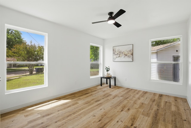 1900 Sussex Dr, Garland, TX 75041 - unfurnished room with healthy amount of natural light, wood finished floors, and baseboards