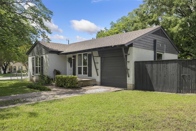 1900 Sussex Dr, Garland, TX 75041 - single story home with brick siding, roof with shingles, and an attached garage