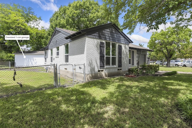 1900 Sussex Dr, Garland, TX 75041 - view of property exterior featuring a gate, brick siding, and roof with shingles
