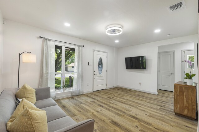 1900 Sussex Dr, Garland, TX 75041 - entrance foyer with light wood finished floors, baseboards, and recessed lighting