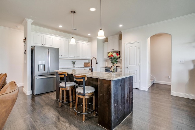 340 Sanger Dr, Springtown, TX 76082 - kitchen featuring stainless steel appliances, white cabinetry, light stone counters, dark wood-style floors, and recessed lighting