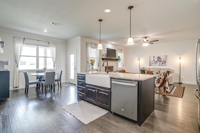 340 Sanger Dr, Springtown, TX 76082 - kitchen with stainless steel dishwasher, a sink, crown molding, open floor plan, and dark wood-type flooring