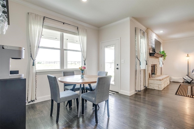 340 Sanger Dr, Springtown, TX 76082 - dining space featuring dark wood-style floors, baseboards, ornamental molding, a fireplace, and recessed lighting