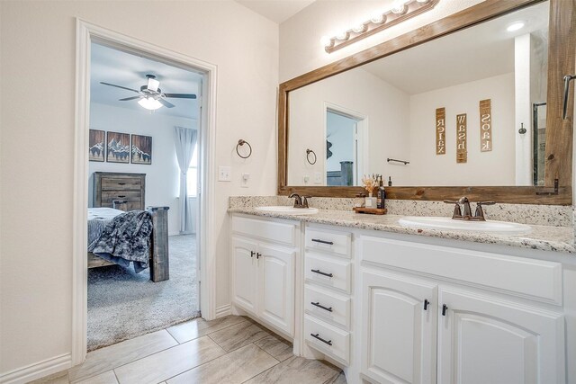 340 Sanger Dr, Springtown, TX 76082 - ensuite bathroom with double vanity and a ceiling fan