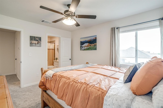 340 Sanger Dr, Springtown, TX 76082 - bedroom featuring carpet, baseboards, ceiling fan, and ensuite bath
