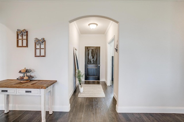 340 Sanger Dr, Springtown, TX 76082 - foyer with arched walkways, crown molding, dark wood finished floors, and baseboards