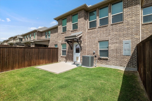 5542 Yellowstone Rd, The Colony, TX 75056 - rear view of house featuring central air condition unit, a patio area, and brick siding