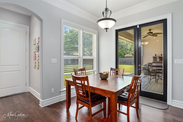 152 Sand Beach Blvd, Shreveport, LA 71105 - dining room with dark wood finished floors, arched walkways, and crown molding