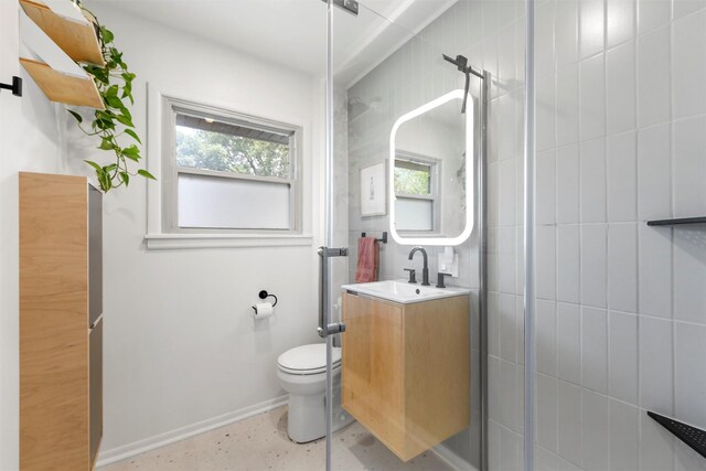2137 Lenamon St, Waco, TX 76710 - bathroom with vanity, toilet, tiled shower, and baseboards