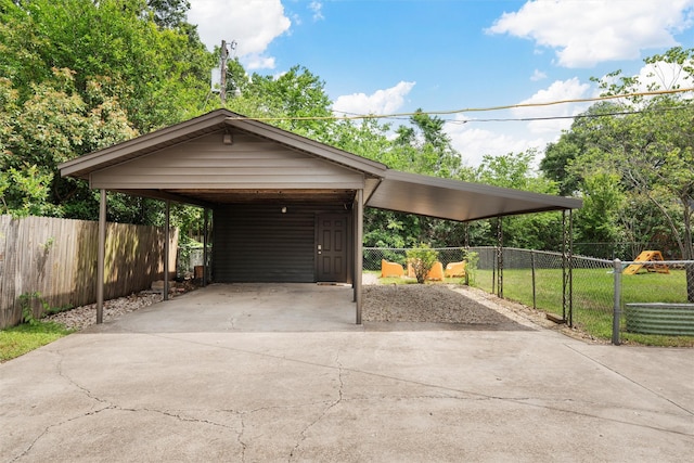 2137 Lenamon St, Waco, TX 76710 - view of front of house with concrete driveway, a carport, and fence