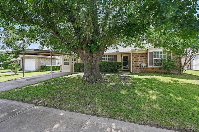 5605 Santa Fe Trl, Haltom City, TX 76148 - view of front of house with a front yard, brick siding, and asphalt driveway