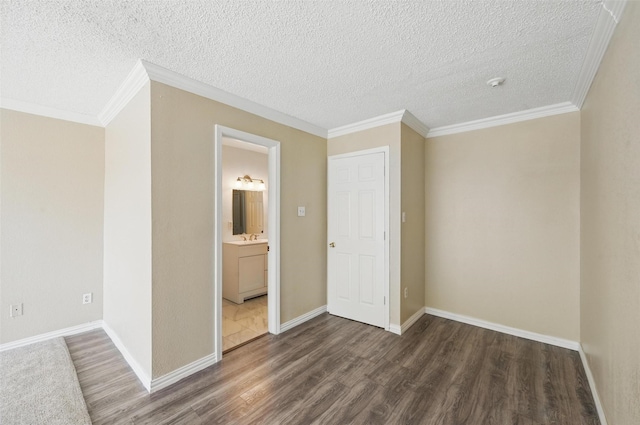 5605 Santa Fe Trl, Haltom City, TX 76148 - unfurnished bedroom with wood finished floors, crown molding, a sink, a textured ceiling, and baseboards