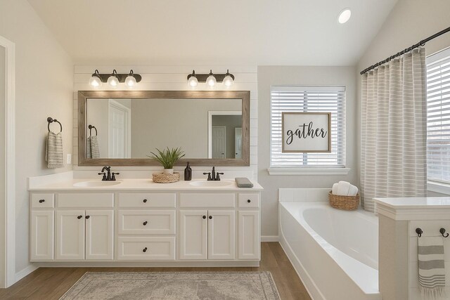1212 Wheatear, Little Elm, TX 75068 - full bath with wood finished floors, a bath, lofted ceiling, and double vanity