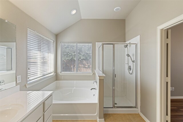 1212 Wheatear, Little Elm, TX 75068 - bathroom with a stall shower, a garden tub, tile patterned floors, vanity, and vaulted ceiling