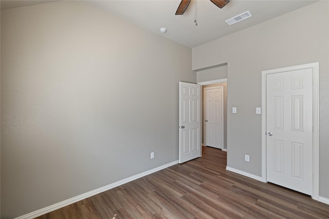 1212 Wheatear, Little Elm, TX 75068 - unfurnished bedroom with dark wood-type flooring, baseboards, and a ceiling fan