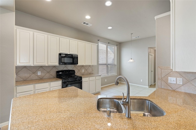 1212 Wheatear, Little Elm, TX 75068 - kitchen featuring black appliances, a sink, baseboards, white cabinetry, and backsplash