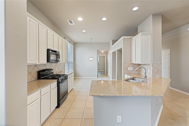 1212 Wheatear, Little Elm, TX 75068 - kitchen featuring black appliances, a sink, light tile patterned flooring, decorative backsplash, and recessed lighting