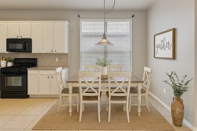 1212 Wheatear, Little Elm, TX 75068 - dining area featuring light tile patterned floors and baseboards
