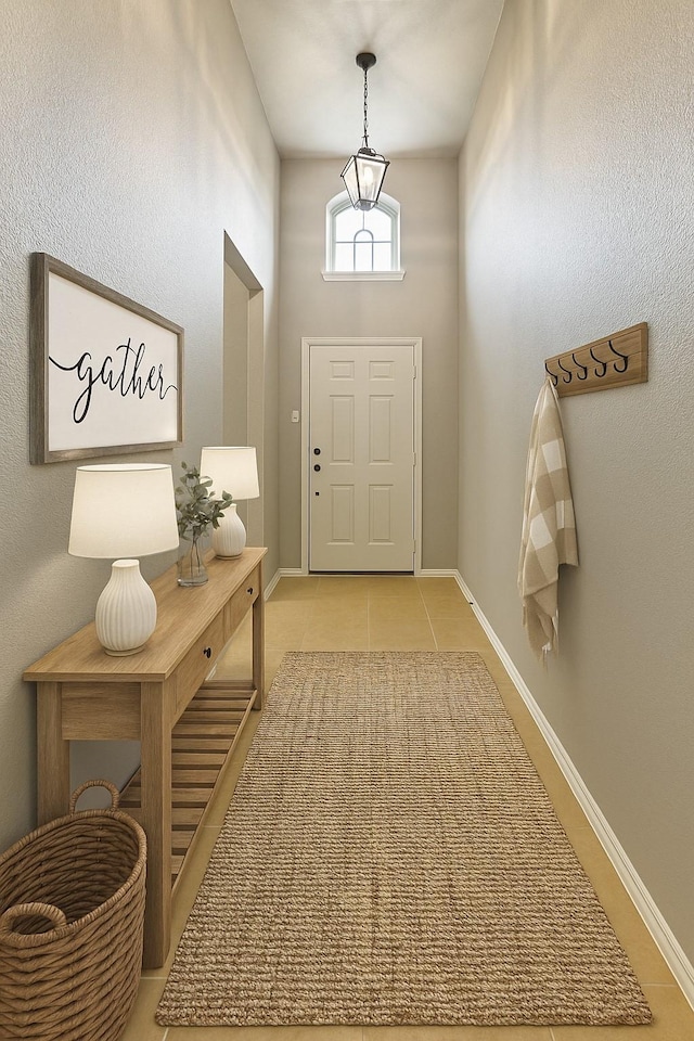 1212 Wheatear, Little Elm, TX 75068 - doorway with light tile patterned flooring and baseboards
