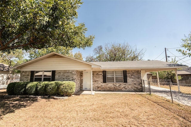 97 Wade St, Nocona, TX 76255 - ranch-style house featuring brick siding, a carport, and concrete driveway